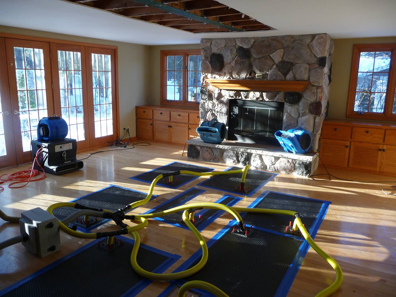 Drying the hardwood floors of Tom "Mel" Stanton's (Mel's Charities) home after flooding.